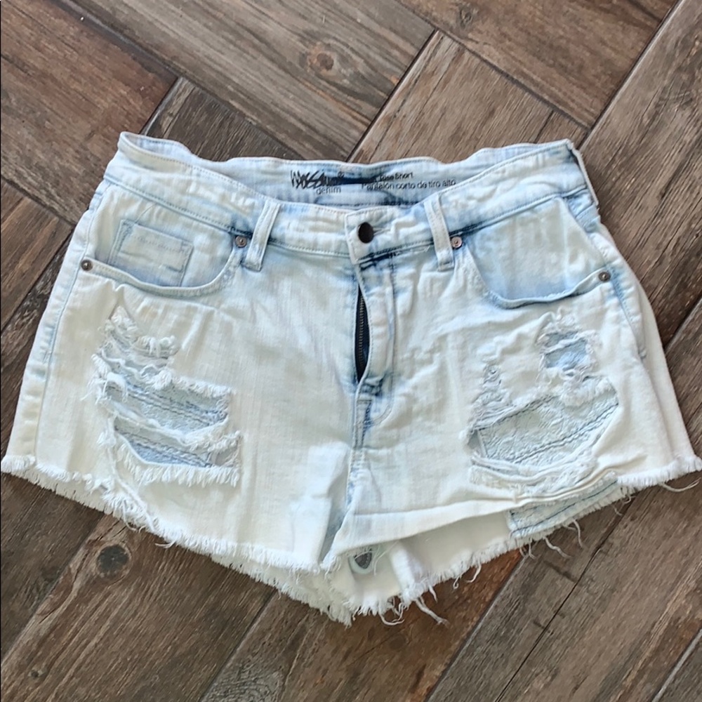 Light washed distressed denim shorts